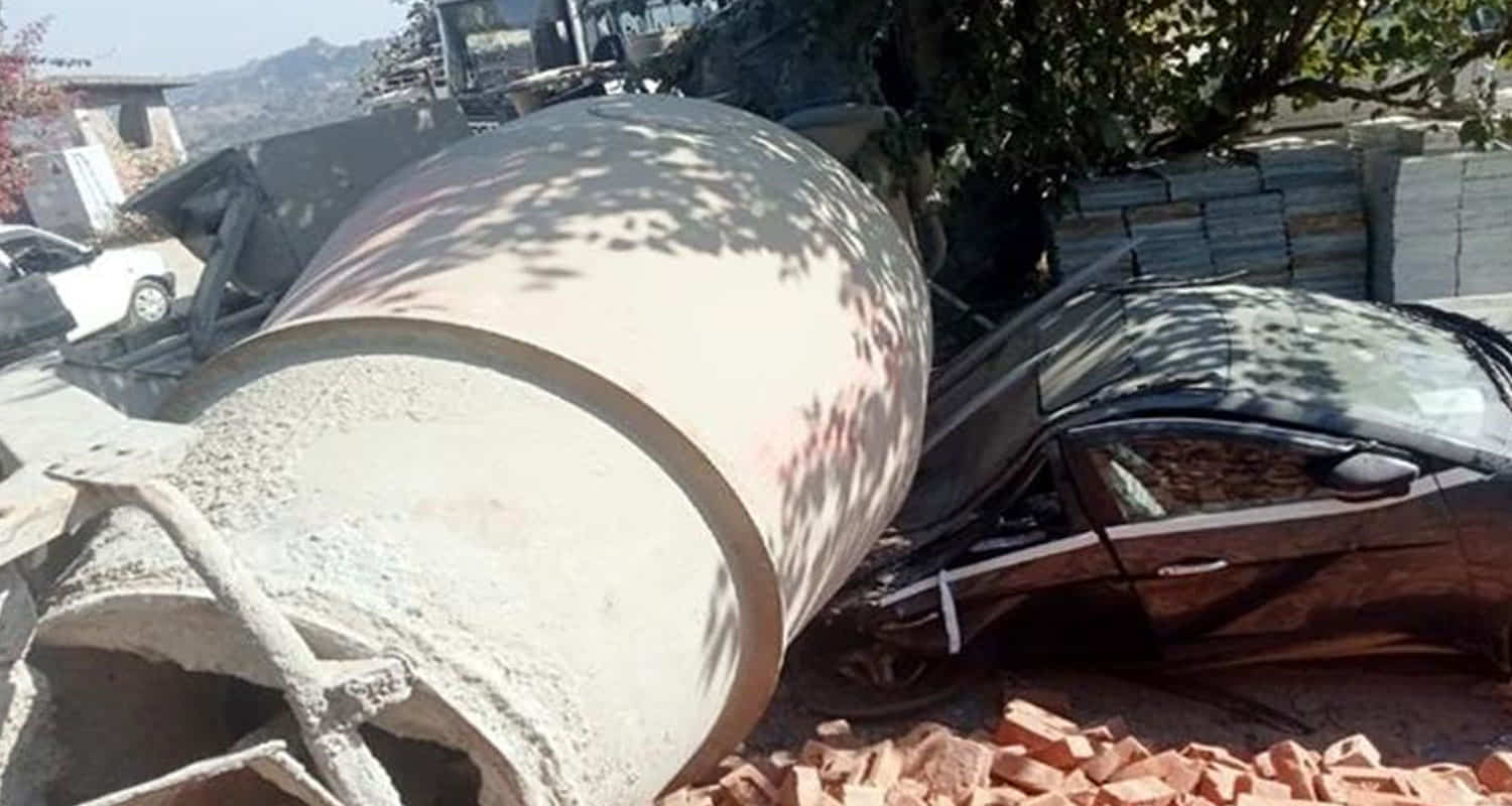 Himachal hamirpur mixer truck loaded on a trailer fell on a car